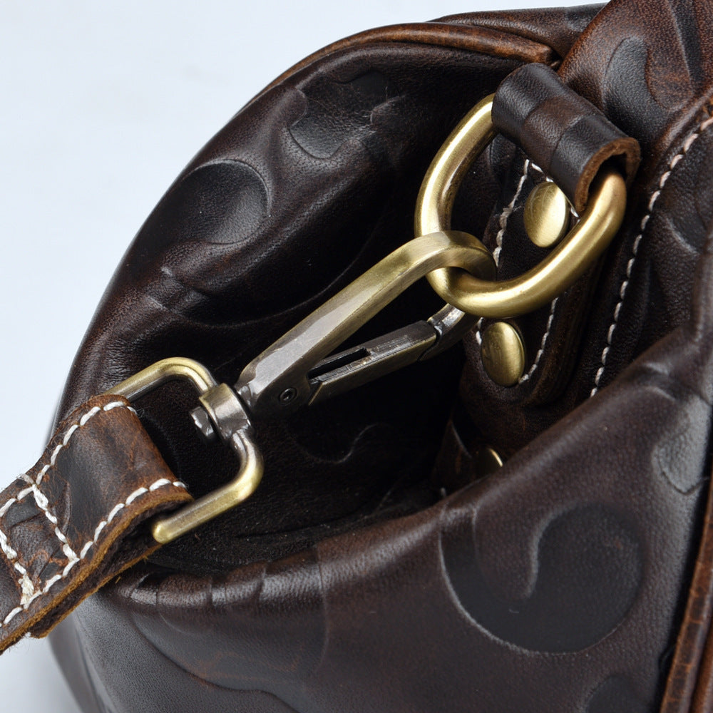 Elegant Retro Embossed Leather Satchel Bag with Secure Buckle and Adjustable Strap