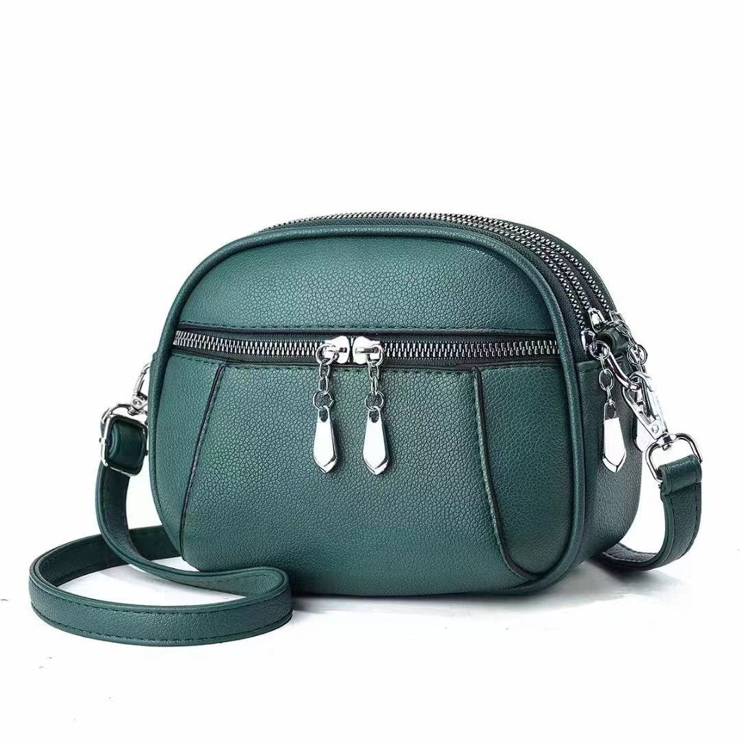 Stylish Solid Color Round Crossbody Bag for Women - Multi-Pocket Design