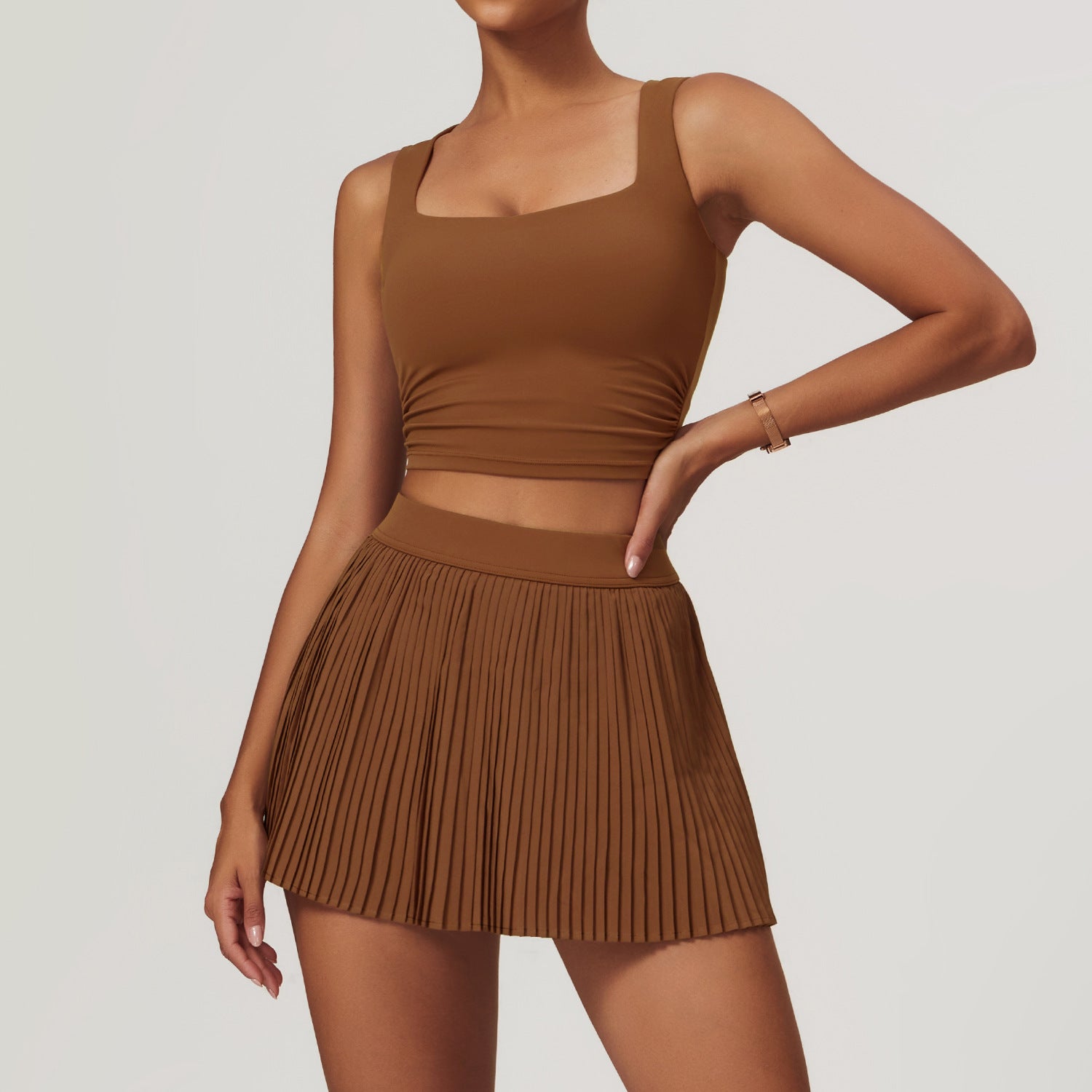 Women's Breathable Activewear Sports Set with Crop Top and Pleated Performance Skirt